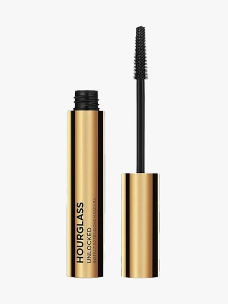 Hourglass Unlocked Instant Extensions Mascara gold tube of mascara on light gray background